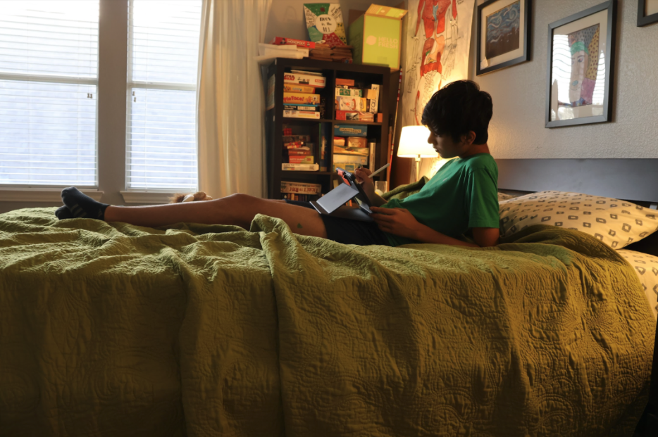 The Sidekick staff writer Neev Chickermane completes his homework on his bed. Chickermane is thankful for his bed because it allows him to relax, rejuvenate and find comfort when needed.